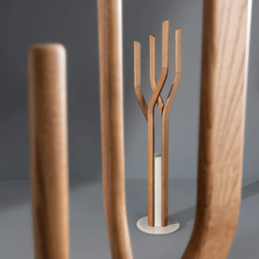 Captivating Bonaldo Alma coat stand with a floor-mounted concrete base and spiraling solid wood stems in a light brown finish