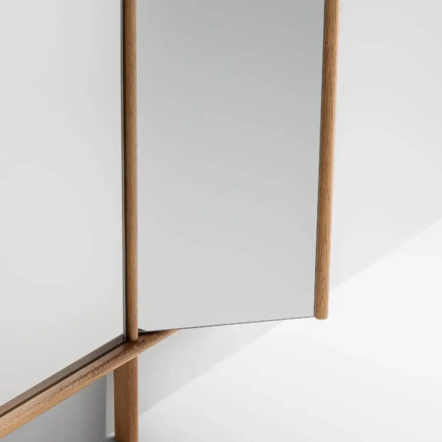 Elegant Bonaldo Isola mirror with a movable flag wing encircled in warm-toned solid wood profiles and reflective glass