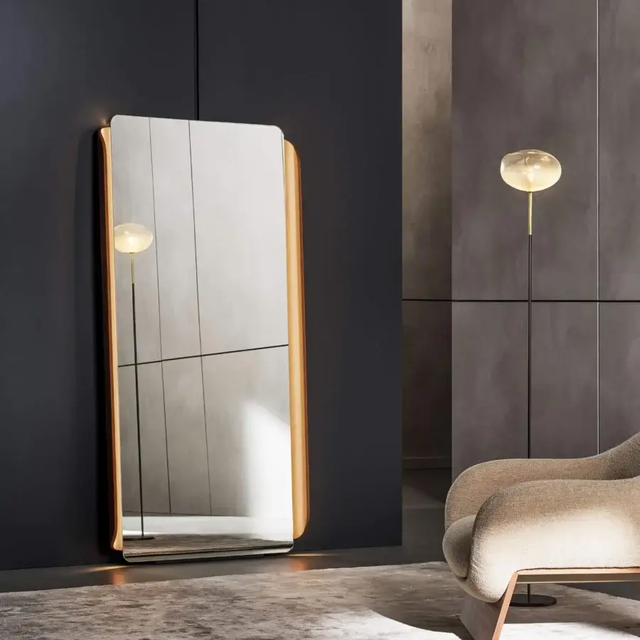 Sophisticated Bonaldo Olos mirror crafted in light-colored wood with an inwardly curved platform and leaning design