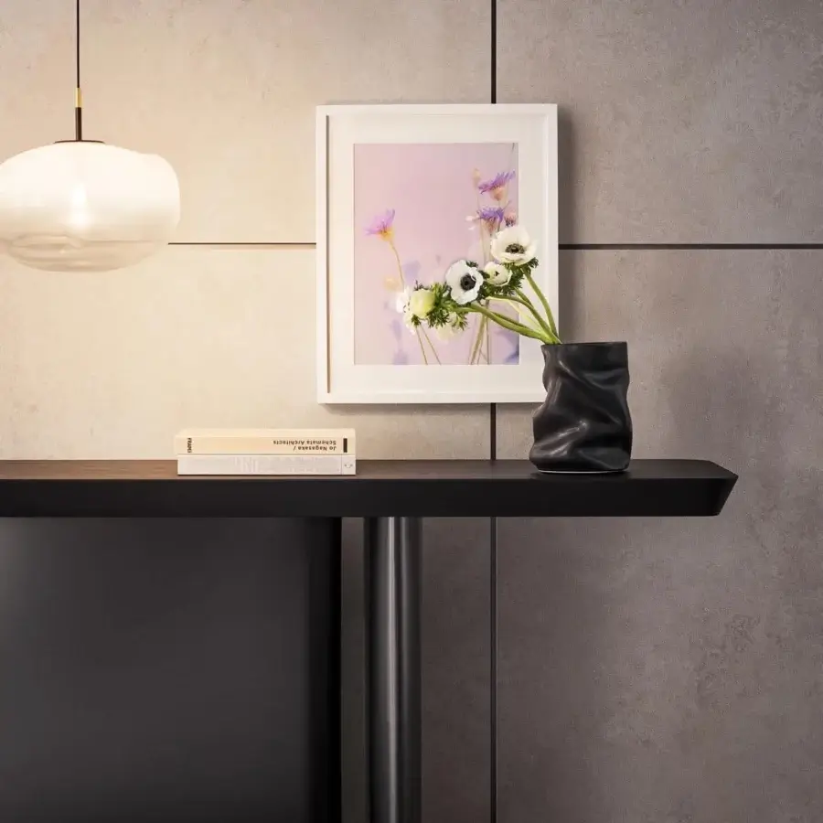 Distinguished Bonaldo One console presents an unexpected silhouette with hand-spatulated clay and a smooth matte black finish