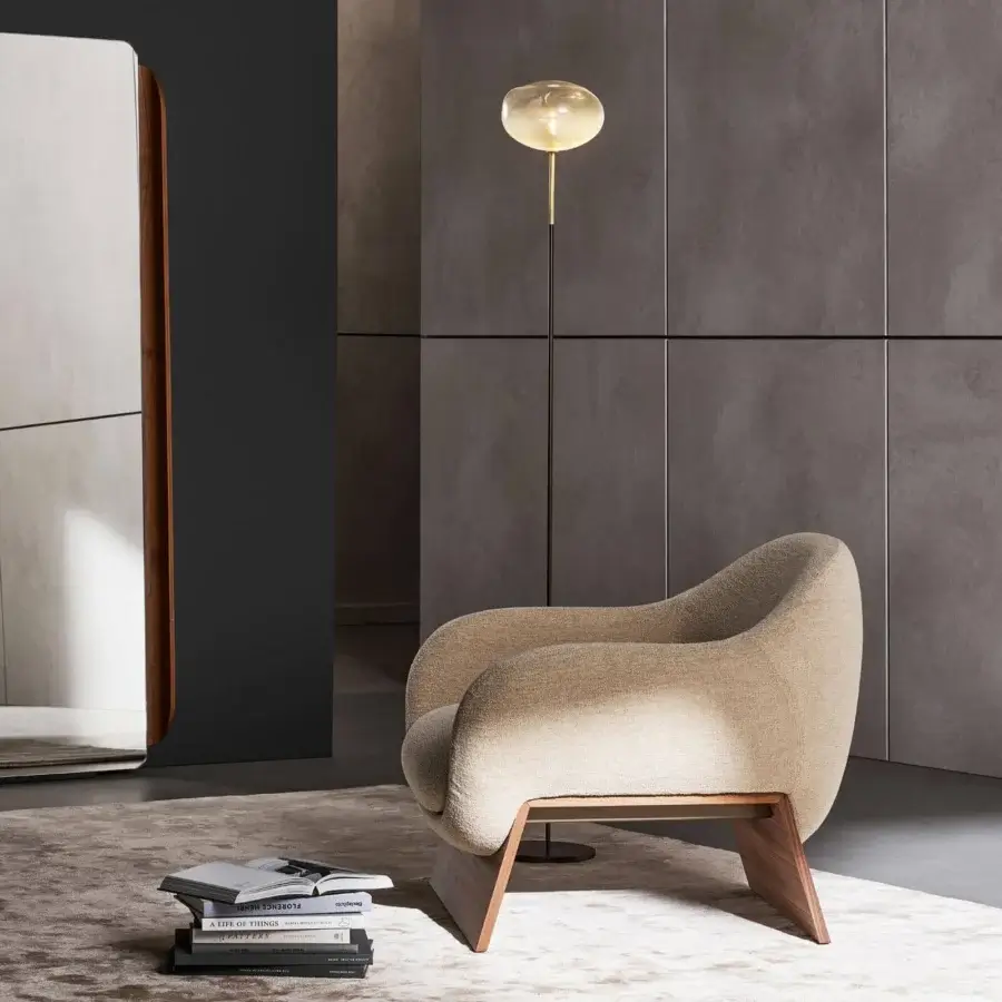 Superior Bonaldo Boolean lounge chair with curved light beige textile and veneered wood base exhibiting angled design