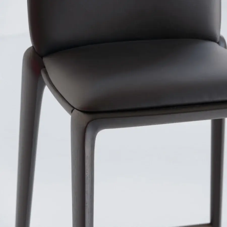 Distinguished Potocco Hiru stool with dark synthetic leather seat and helical dark-finished wooden frame