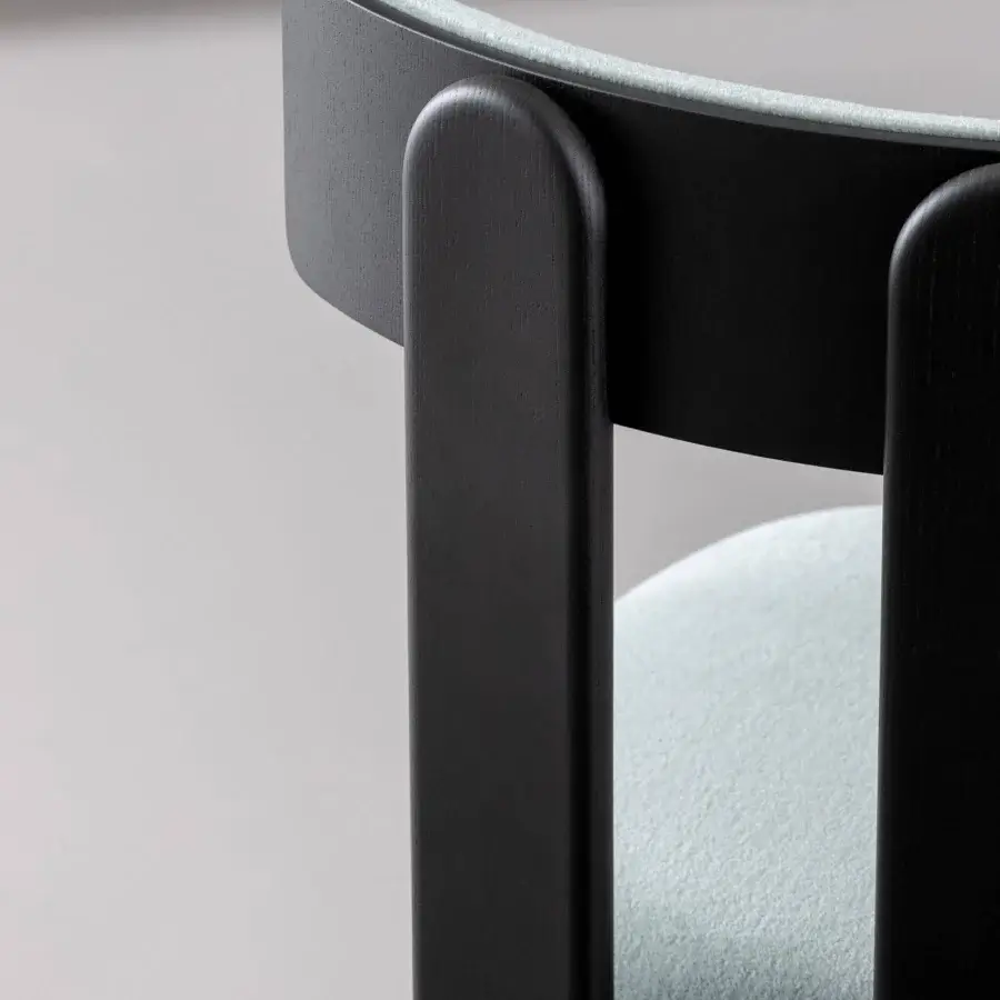 Exceptional Bonaldo Pi chair crafted in Italy with light green textile cushions and matte black wood supports