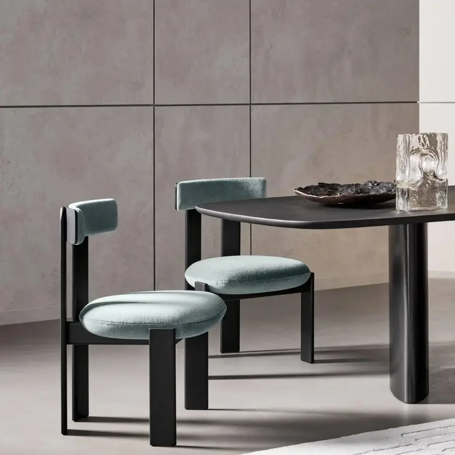 Distinguished Bonaldo Pi chair with black-finished wood and soft light blue fabric cushions exhibiting a minimalist silhouette