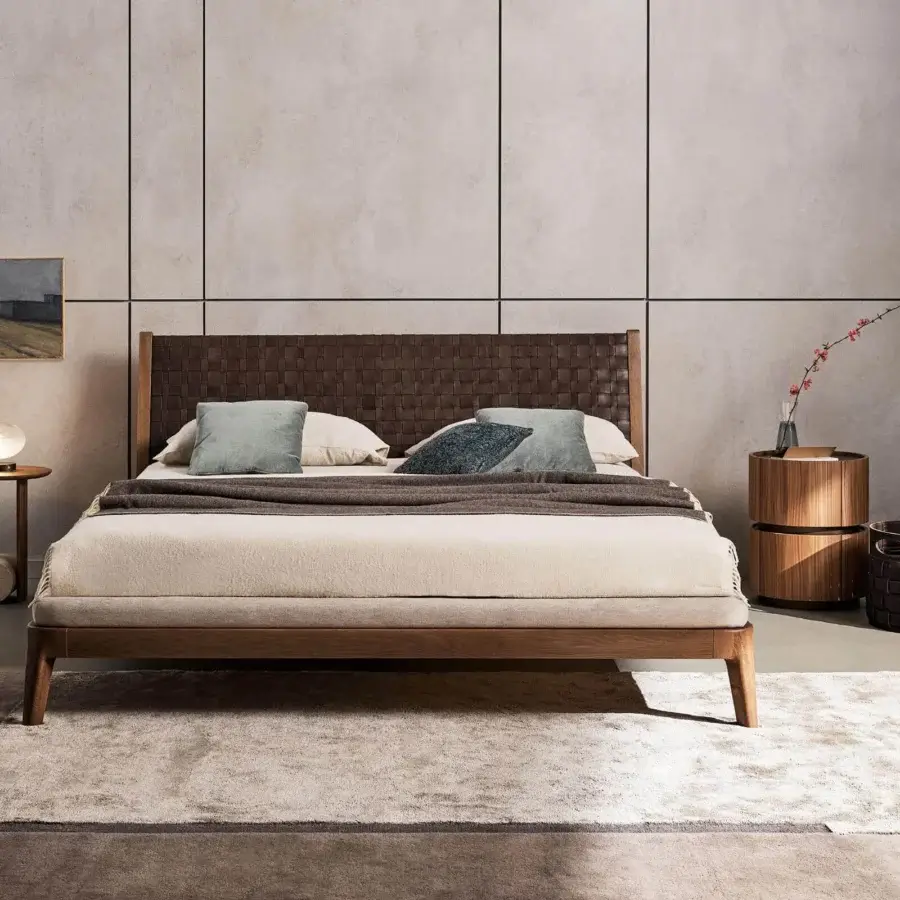 Exceptional Bonaldo Honeymoon bed with hand-woven full-grain brown leather headboard and curved solid wood frame