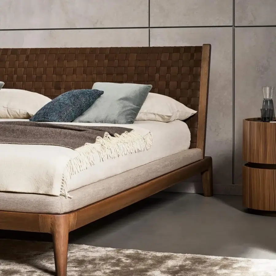 Meticulous Bonaldo Honeymoon bed with hand-woven brown leather headboard and warm solid wood frame built in Italy
