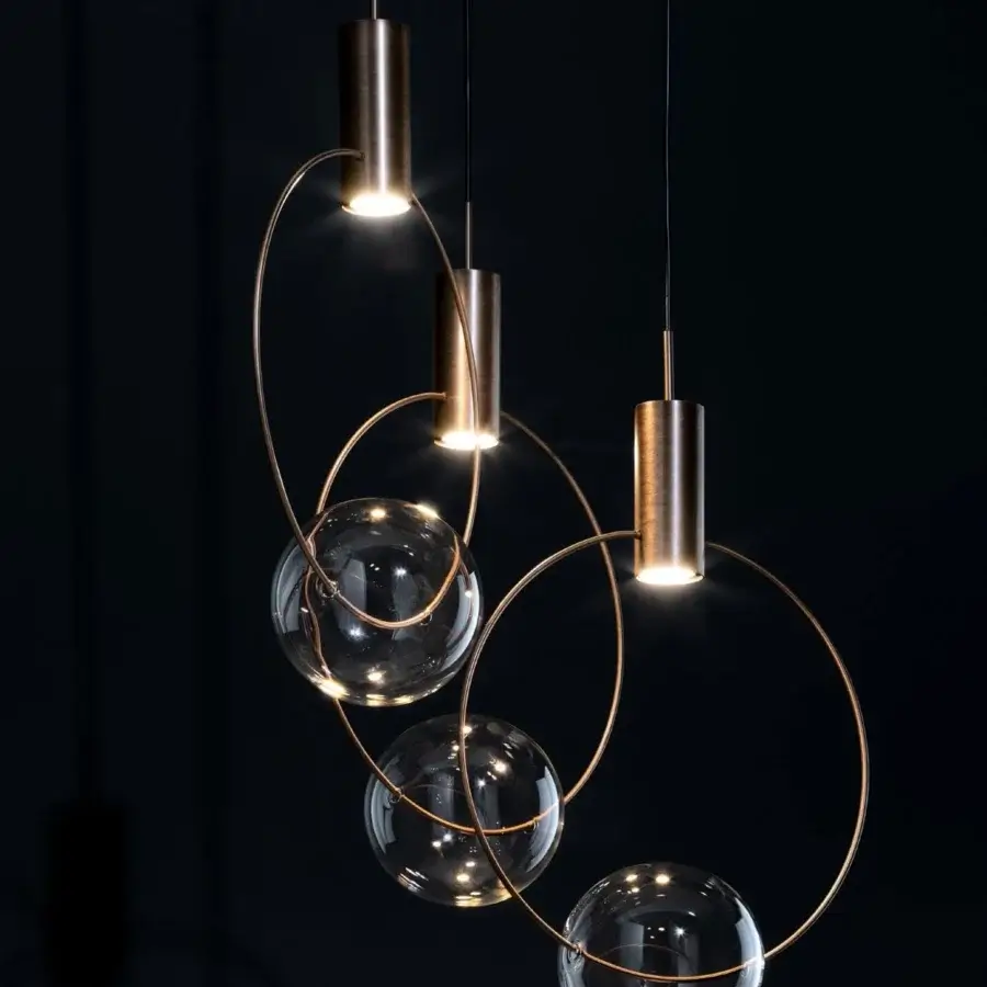 Captivating Bonaldo Keshi suspension lamp with transparent blown glass spheres encased in brass-colored metal with a satin sheen