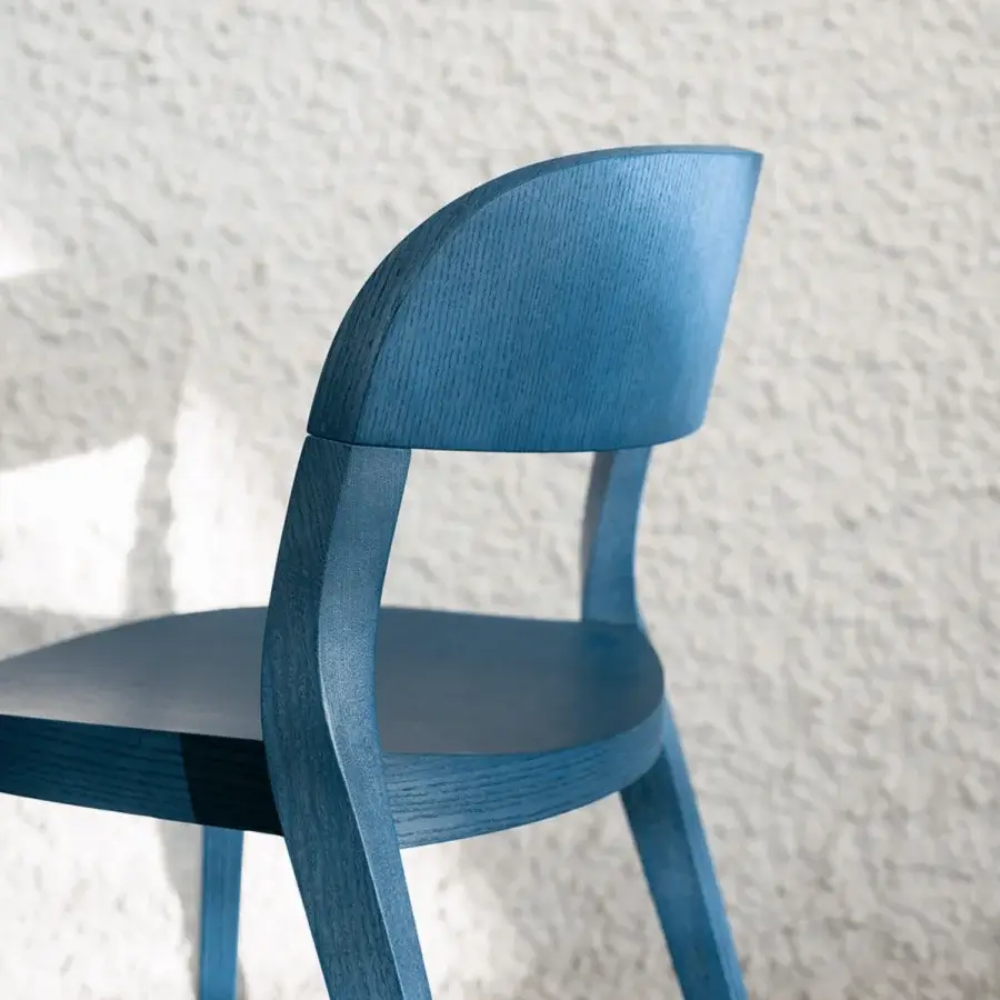 Superior Potocco Minima Wood Version chair in uniform blue with solid ash wood legs and a textured matte finish