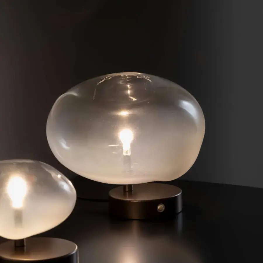 Elegant Bonaldo Pepita table lamp with clear to frosted silk glass lampshade and dark bronze toned metal base