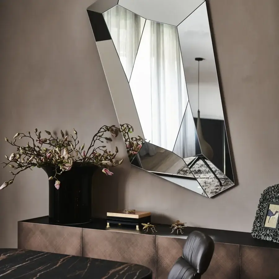 Distinguished Cattelan Italia Diamond mirror with angular form built in mirrored glass creating a multifaceted reflective surface