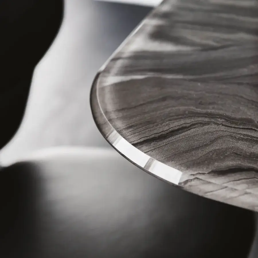 Elegant Cattelan Italia Giano CrystalArt table with graphite embossed steel and beveled extra clear glass exhibiting stone-like veining