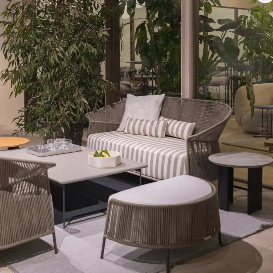 Distinguished Potocco Ola ottoman with hand-woven light brown ribbon and sleek powder-coated stainless steel legs
