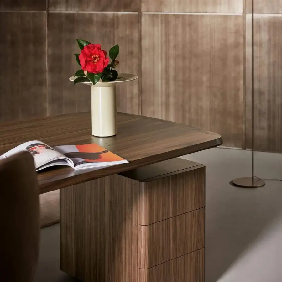 Elegant Bonaldo Diver desk with a curved wooden top, sleek cabinet and clean metal base in a rich brown hue
