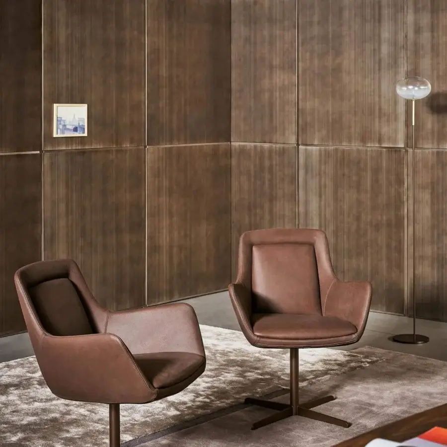 Superior Bonaldo Newton armchair with enveloping seat in matte medium brown leather and sleek metal swivel base
