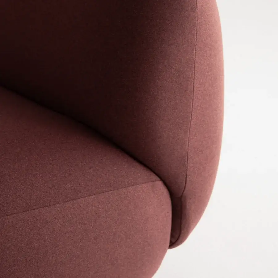 Lavish Potocco Jade lounge chair upholstered in brownish-red textile with a textured matte finish and sinuous shapes