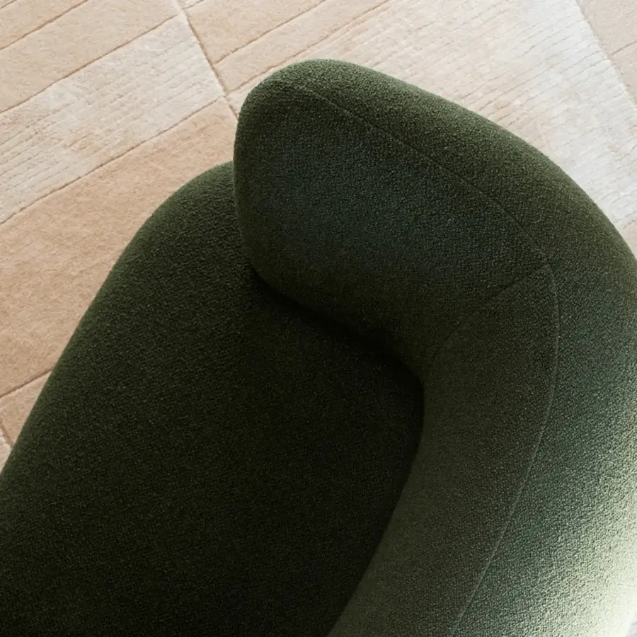 Distinguished Potocco Jade lounge armchair crafted in Italy with dark green textile and sinuous lines