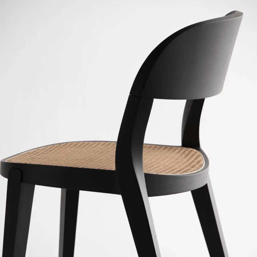 Exquisite Potocco Minima Vienna Straw Version chair crafted with sleek black frame and sinuous wooden structure in Viennese straw