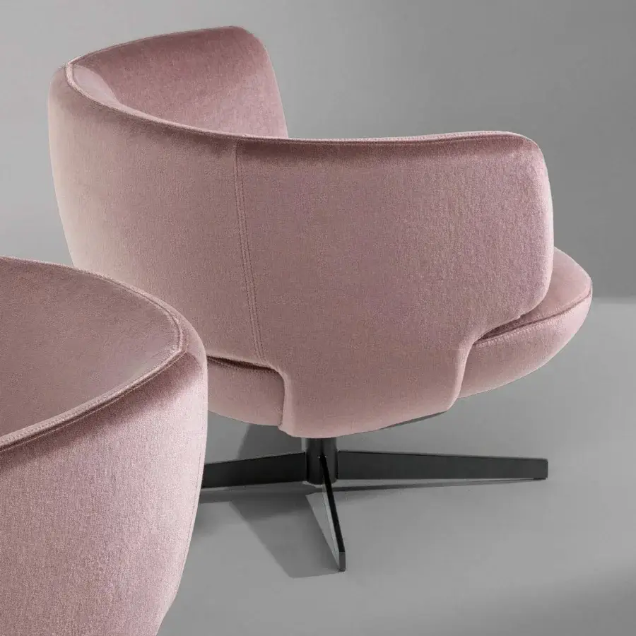 Superior Bonaldo Doge lounge chair with headgear-shaped flaps and muted pink textile upholstery with dark metal base