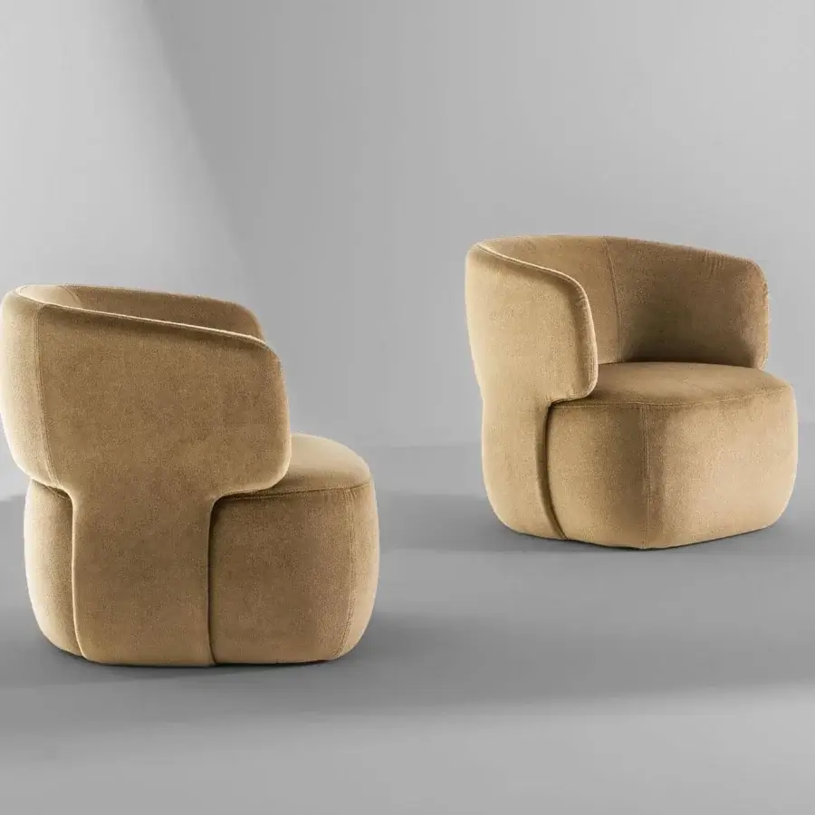 Elegant Bonaldo Doge lounge chair with curved silhouette upholstered in light brown textile and padded construction