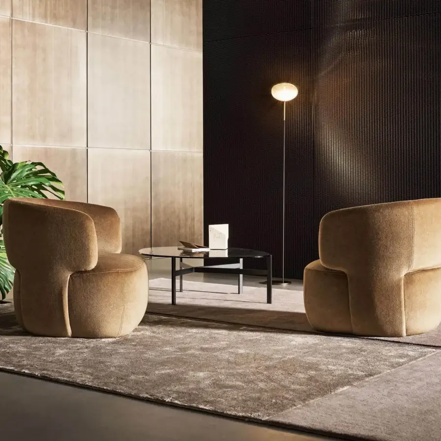 Distinguished Bonaldo Doge lounge chair with automatic return, upholstered in medium-brown textile with a swivel metal base