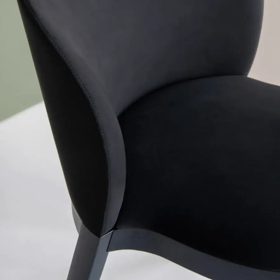 Exceptional Potocco Trousse chair with curved dark upholstery and lighter piping built with a solid ash wood frame