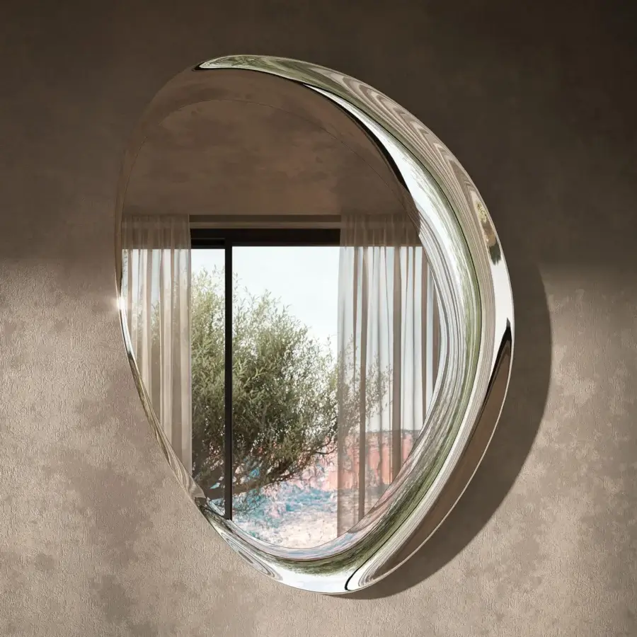 Captivating Cattelan Italia Ascot mirror with fluid silhouette and bright silver reflective frame exhibiting a polished finish
