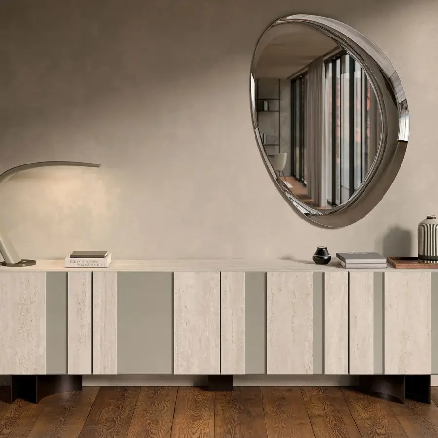 Distinguished Cattelan Italia Ascot mirror with eye-like silhouette and polished silver frame creating shifting reflections