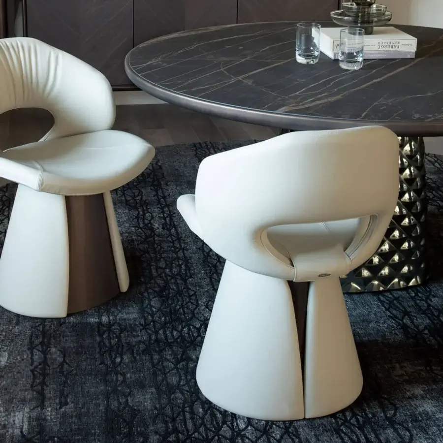 Sophisticated Cattelan Italia Dafne chair with organically curved silhouette, white upholstery and brilliantly finished metal breastplate