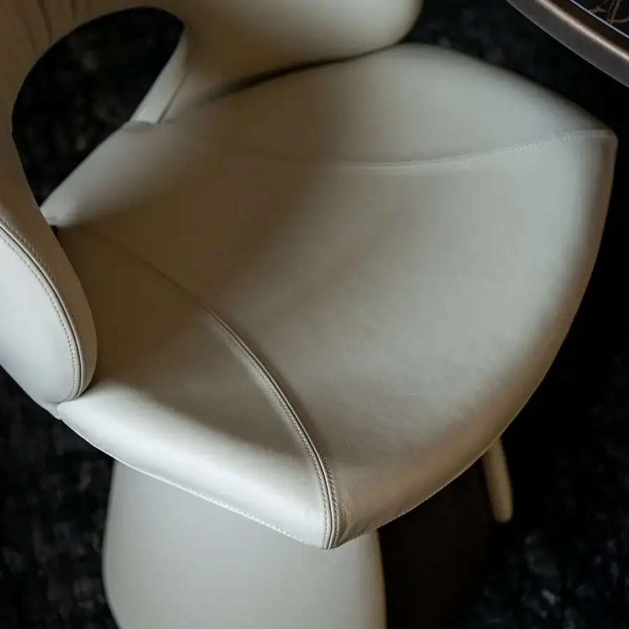 Exclusive Cattelan Italia Dafne chair with unique perforated backrest and light gray upholstery crafted with a pedestal base