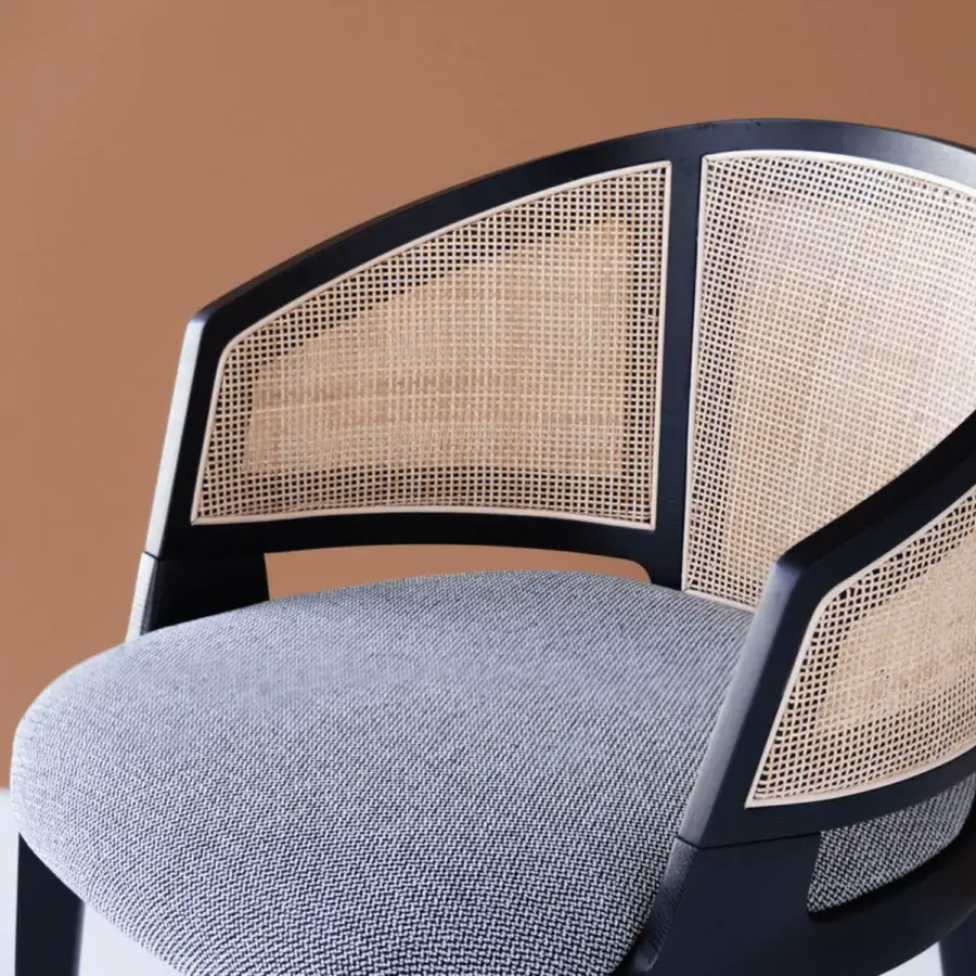 Refined Potocco Velis Cane dining armchair crafted in Italy with dark matte wood and gray white patterned textile upholstery