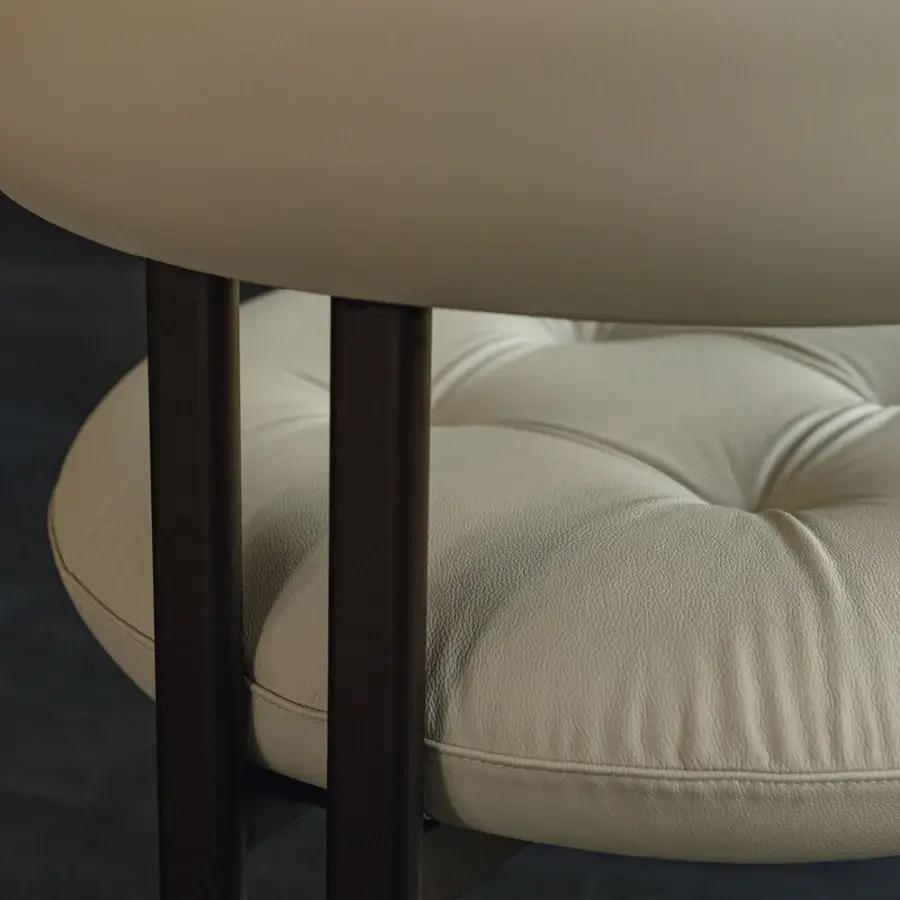 Distinctive Cattelan Italia Greta armchair with enveloping cream cushion and slender metal legs in textured varnish