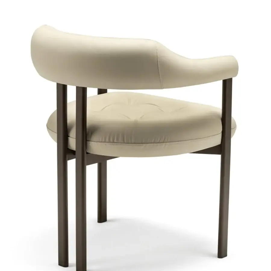 Distinguished Cattelan Italia Greta armchair with enveloping light textile upholstery and dark textured varnish metal supports