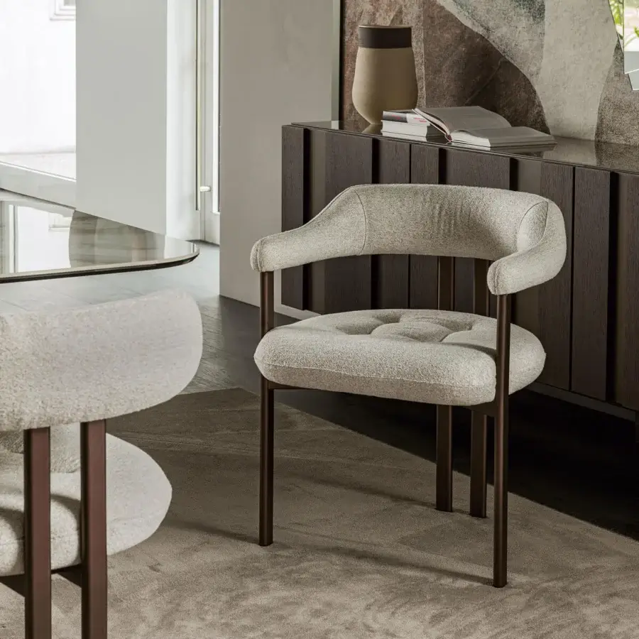 Exclusive Cattelan Italia Greta armchair with wrap-around light beige textile upholstery and dark textured varnish metal legs