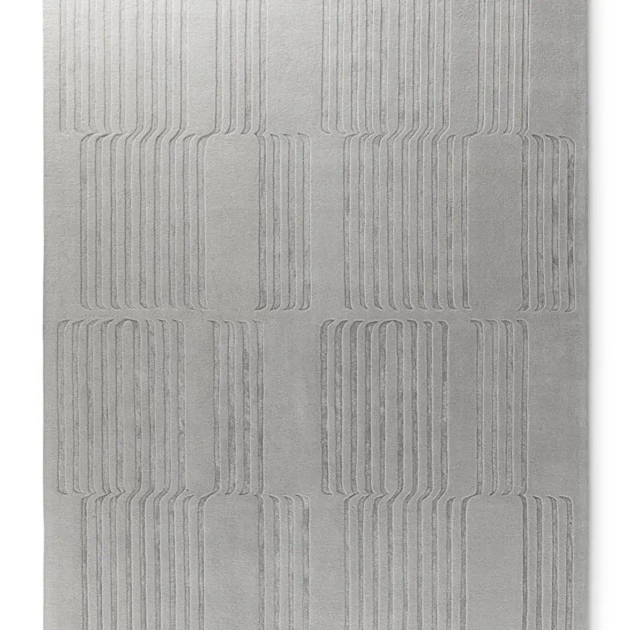 Lavish Bonaldo Tangeri rug with a refined light gray geometric design crafted in wool and Tencel with a textured finish