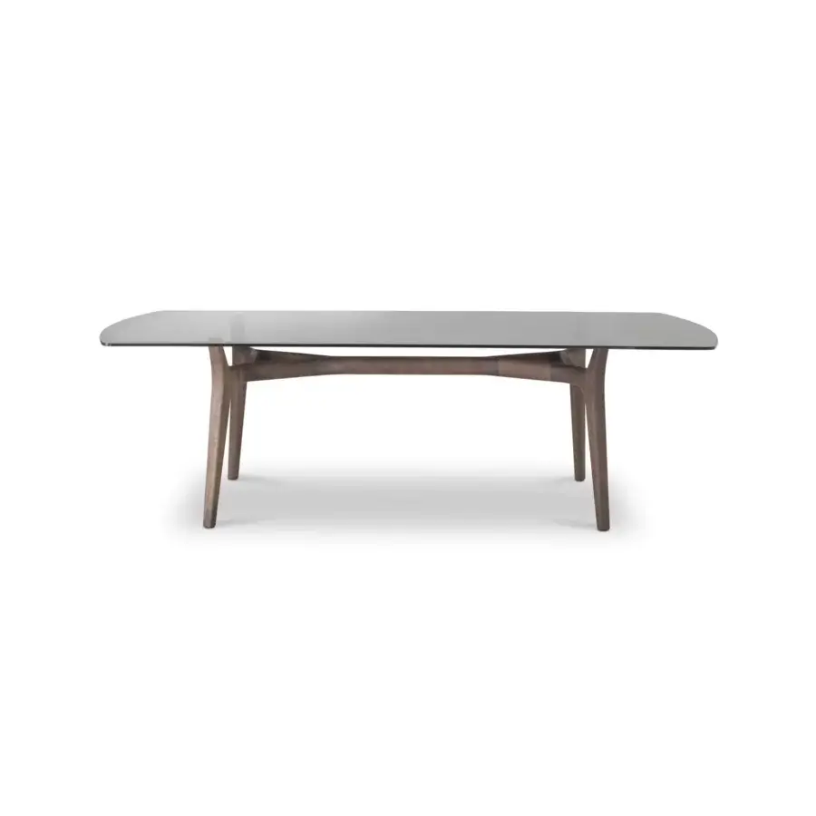 Distinguished 4 Mariani York table with rectangular glass top and smooth medium-brown wood sculptural base crafted in a contemporary form