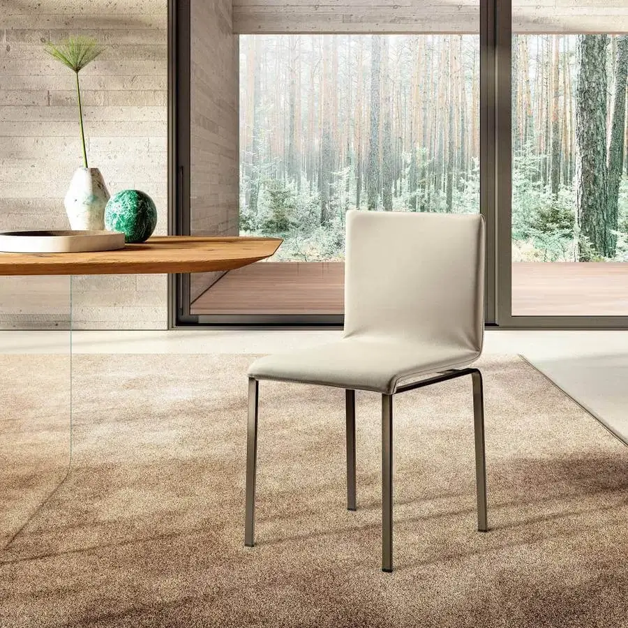 Distinguished Lago Dangla chair with a comfortable ergonomic form and light neutral textile upholstery built with a dark matte metal frame