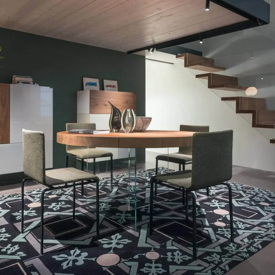 Exceptional Lago Dangla chair with muted green textile upholstery and a sleek dark metal frame with matte finish