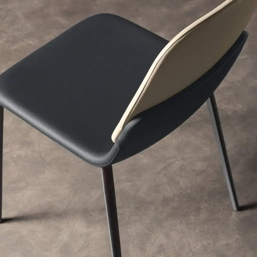 Exceptional Lago Ermes chair crafted with shaped metal and upholstered in dark synthetic material with a beige textured interior