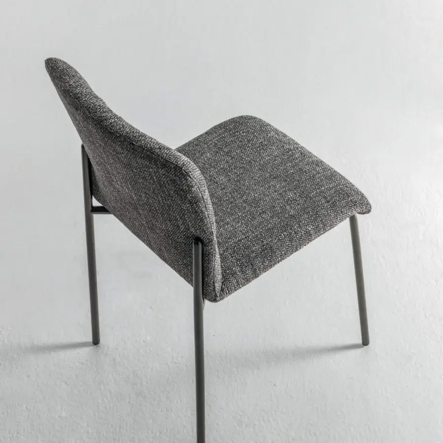 Elegant Lago Woop chair with sinuous form, complex gray-toned fabric upholstery and sleek steel frame