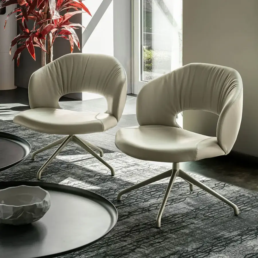 Exceptional Cattelan Italia Miranda lounge chair with light beige upholstery and matching metal base crafted with a distinctive backrest cutout