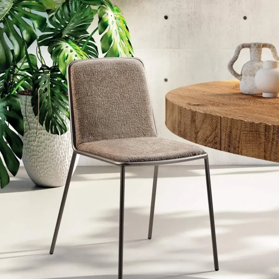 Exceptional Lago Pletra chair with dark metal frame and textured brownish-gray textile upholstery, finished with a matte surface