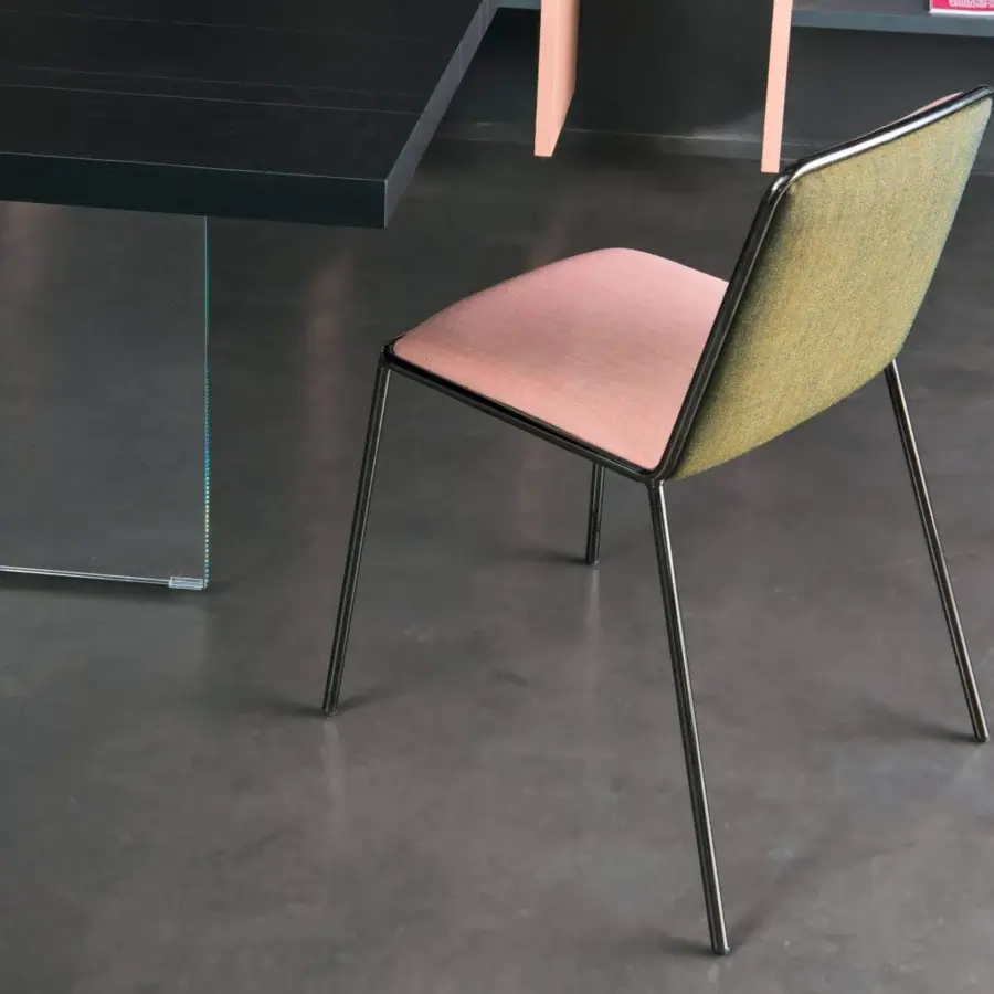 Superior Lago Pletra chair with polished metal frame and pink textile seat, showcasing a contrasting green backrest finish