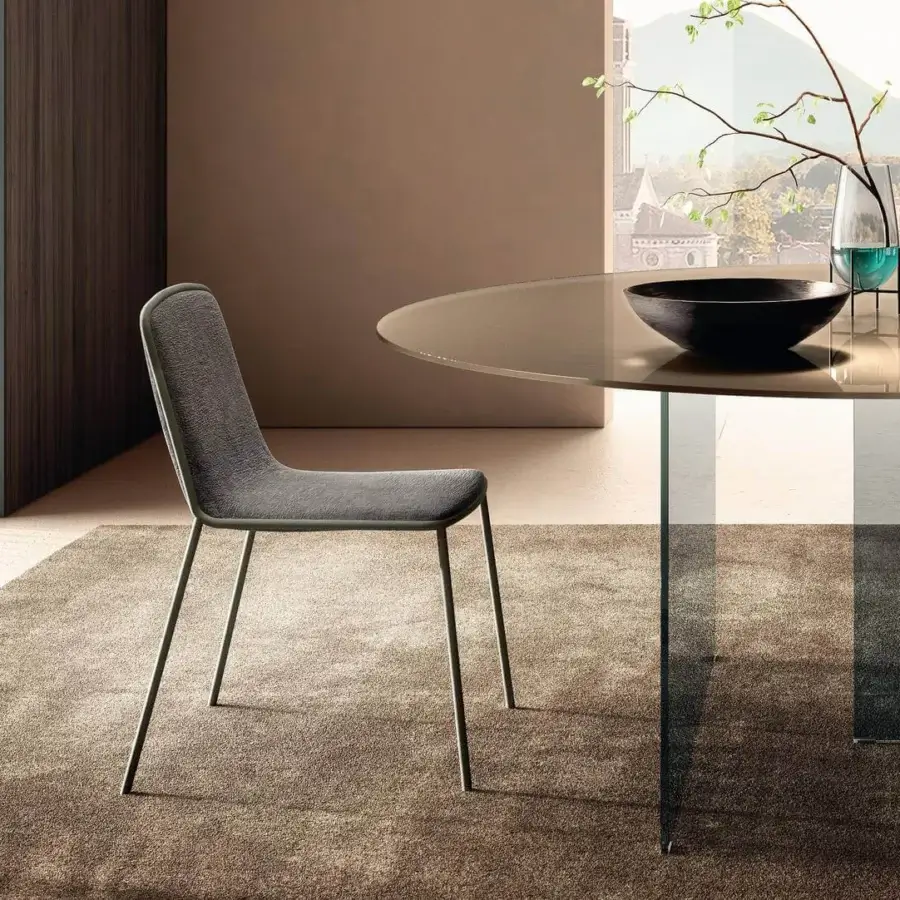 Distinguished Lago Pletra chair with comfortable padding and subtly textured matte medium gray textile upholstery crafted with a slim metal frame