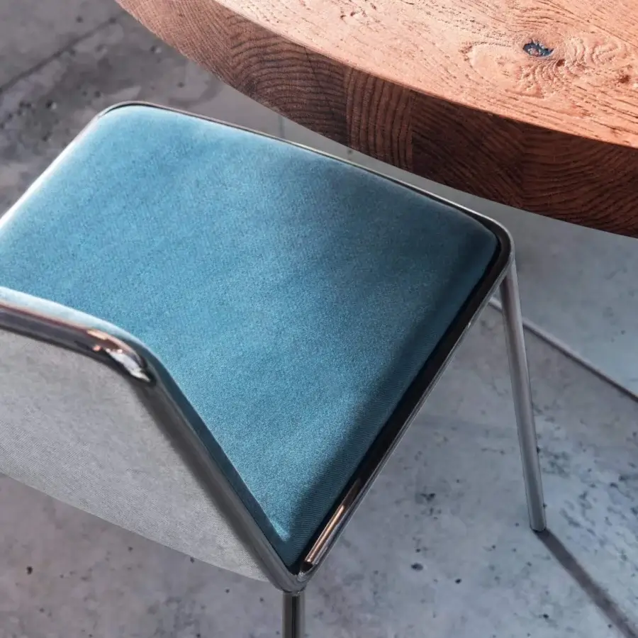 Elegant Lago Pletra chair with a slim metal frame, blue matte textile seat and light gray fabric backrest crafted in Italy