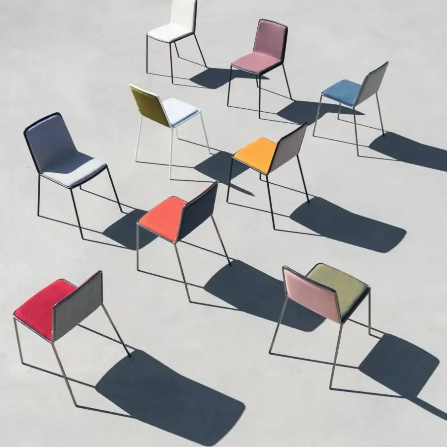 Distinguished Lago Pletra chair with a curved wood seat and vibrant textile upholstery crafted with a slim metal frame