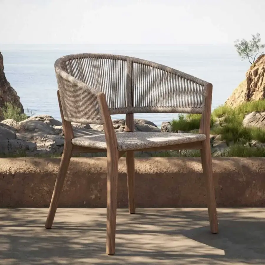 Distinguished Royal Botania Carés armchair with teak frame and light beige rope woven seat offering a matte finish