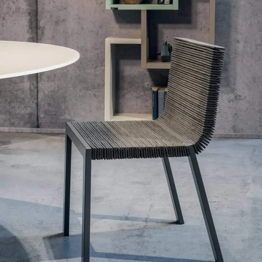 Distinguished Lago Steps chair with industrial felt seat and back in dark gray with matte metal aluminum frame crafted in Italy