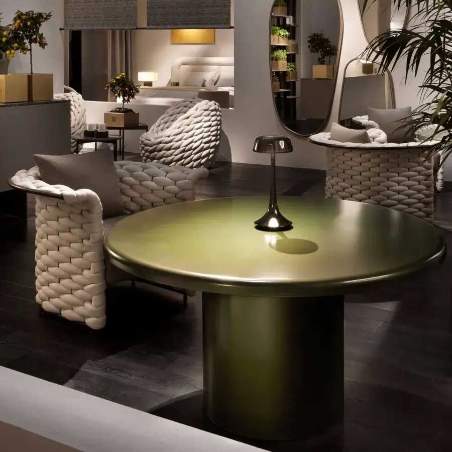 Superior Rugiano Elba table crafted with metal in a green bronze finish exhibiting a contemporary design
