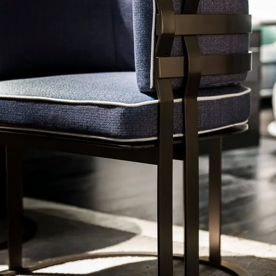 Exclusive Rugiano Arena armchair with deep blue fabric upholstery, white piping and Outdoor Bronze metal frame