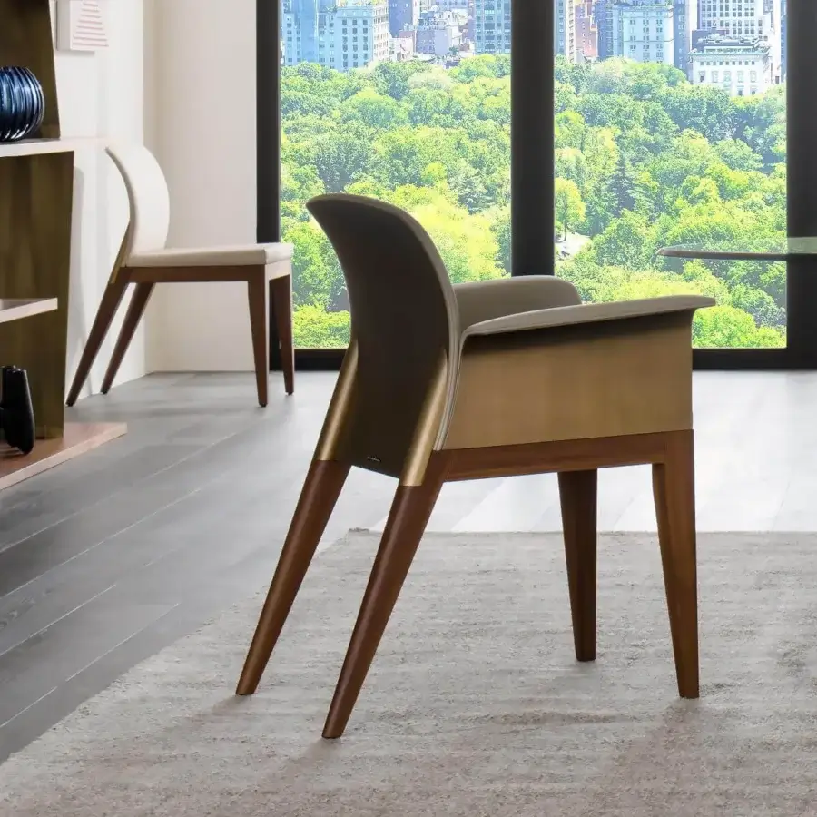 Lavish Reflex Sit modular chair with curved back and nero beluga matt lacquered wood legs upholstered in elegant fabrics or leathers